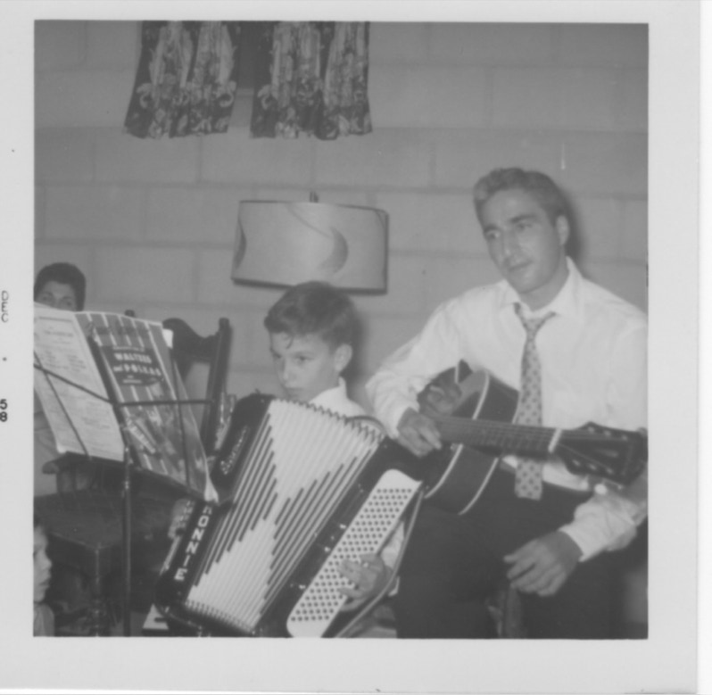 My first full sized accordion with my dad sittingn behind me onthe guitar